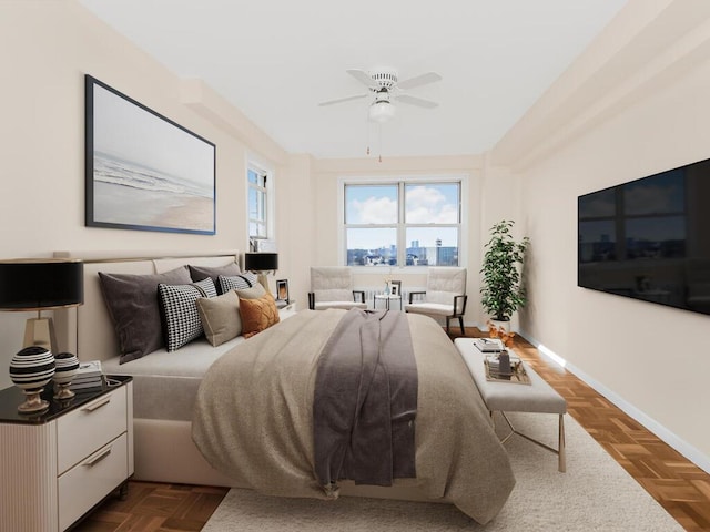 bedroom with a ceiling fan and baseboards