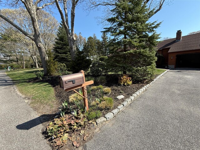 515 Corey Creek Ln, Southold, NY 11971 - exterior details with aphalt driveway