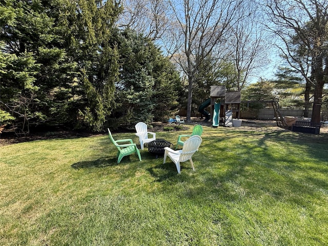 515 Corey Creek Ln, Southold, NY 11971 - view of yard with a playground, a fire pit, and fence