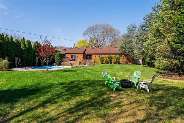 515 Corey Creek Ln, Southold, NY 11971 - view of yard featuring an outdoor pool and an outdoor fire pit