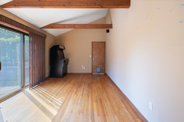 515 Corey Creek Ln, Southold, NY 11971 - empty room featuring lofted ceiling with beams and light wood-type flooring