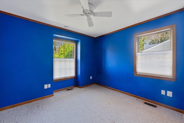 515 Corey Creek Ln, Southold, NY 11971 - carpeted spare room with crown molding, visible vents, and baseboards