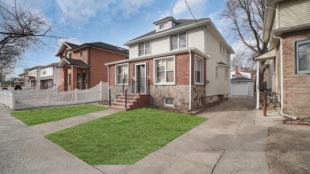 traditional style home featuring an outbuilding, stucco siding, a front yard, fence, and driveway