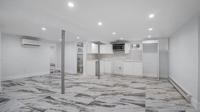 interior space with marble finish floor, recessed lighting, a baseboard heating unit, and a wall mounted AC