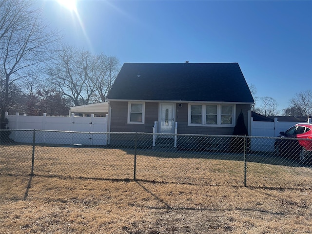 view of front of house with a fenced front yard and a front yard