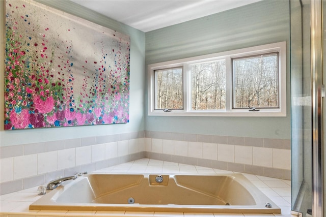 full bathroom with a whirlpool tub