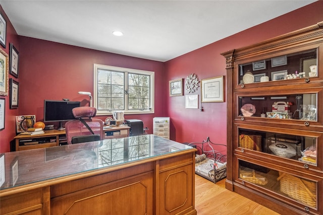 home office with light wood-style flooring and recessed lighting