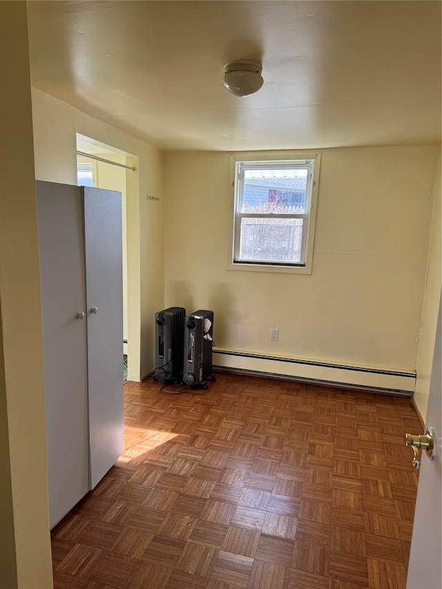 spare room featuring baseboard heating