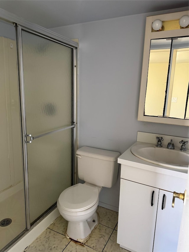 bathroom with toilet, an enclosed shower, and vanity