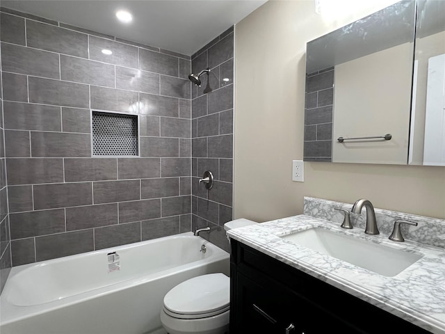 full bath with shower / bath combination, vanity, and toilet