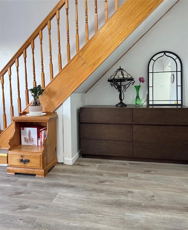 staircase with wood finished floors