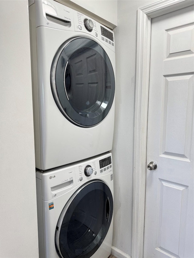 laundry room with stacked washer and dryer