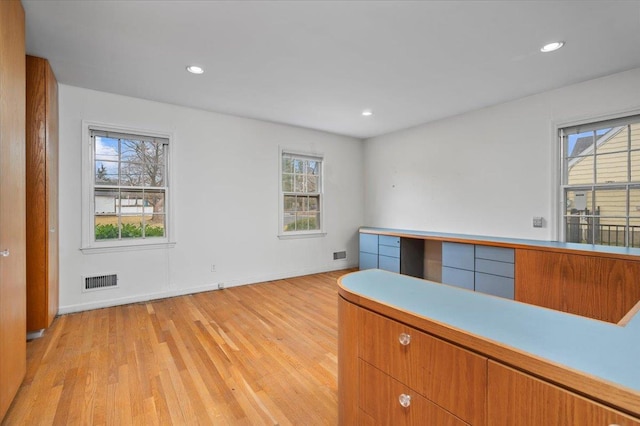 interior space featuring light wood-style floors, visible vents, and recessed lighting