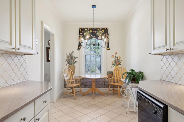 dining space with baseboards, ornamental molding, a chandelier, and light tile patterned flooring