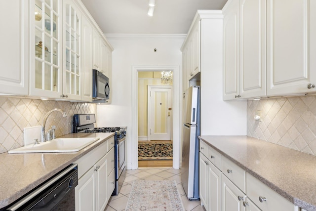 kitchen featuring black appliances, glass insert cabinets, and white cabinets