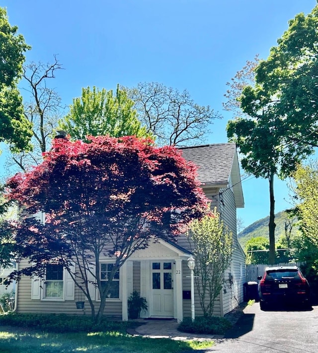 view of front of home featuring roof with shingles