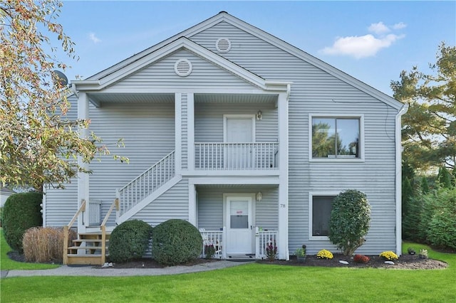 exterior space with a yard and a balcony