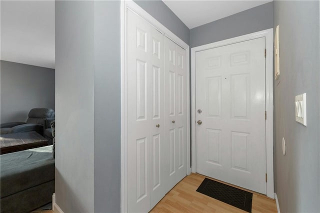 doorway to outside featuring light wood-style floors