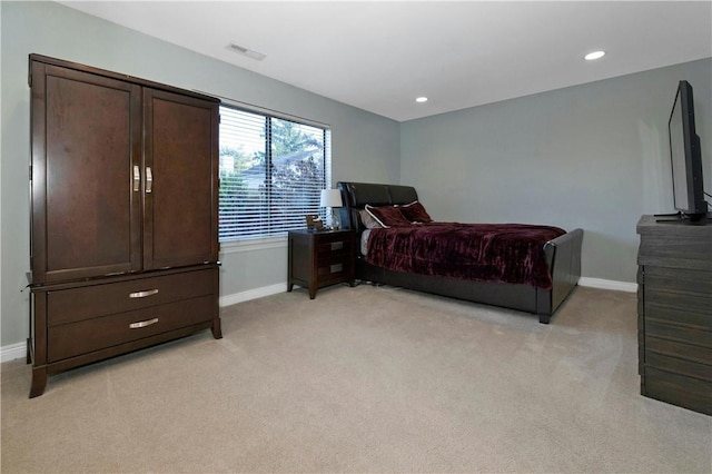 bedroom featuring recessed lighting, light carpet, and baseboards