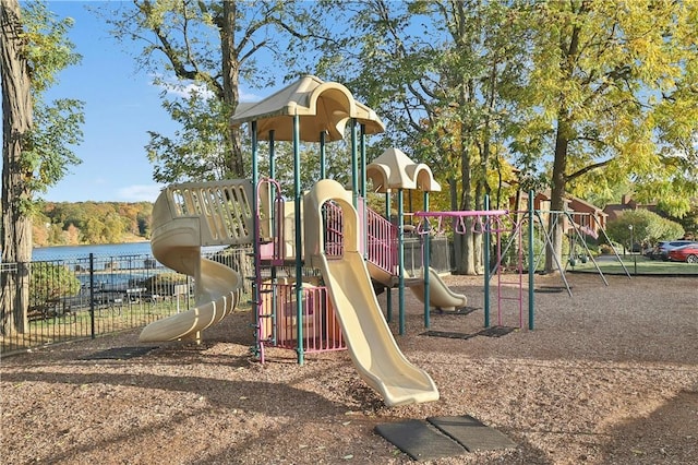 communal playground with a water view and fence