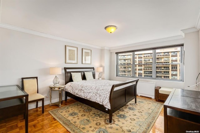 bedroom with baseboards and ornamental molding