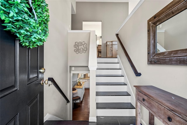 stairway with wood finished floors