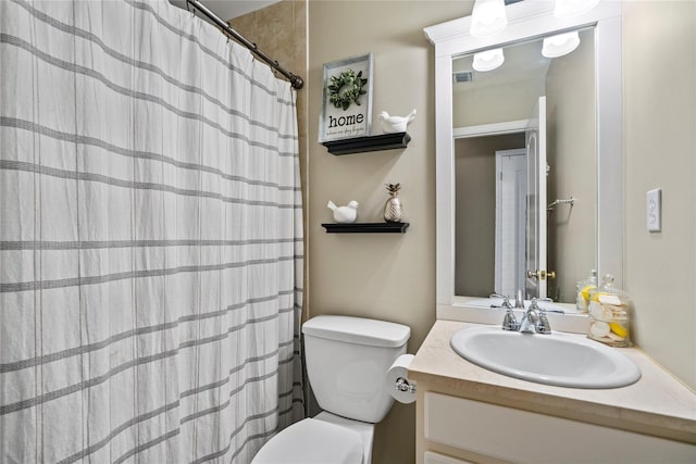 full bathroom with visible vents, vanity, toilet, and a shower with curtain