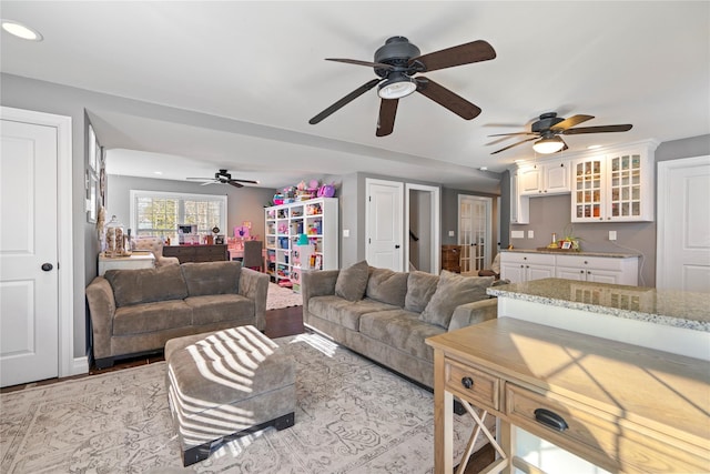 living room with light wood finished floors and recessed lighting