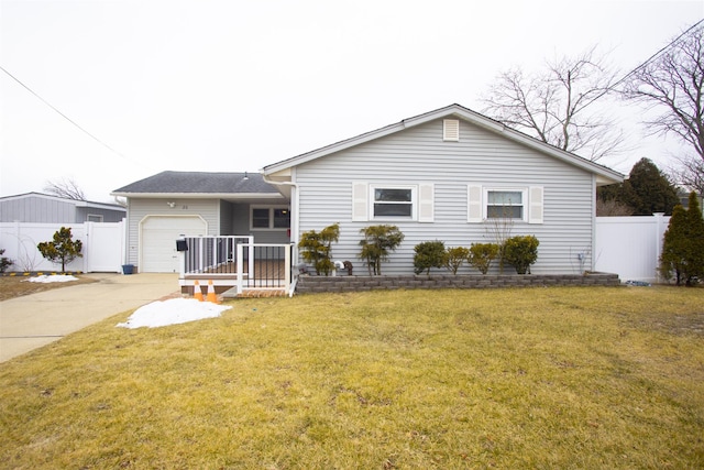 ranch-style home with a garage, a front yard, driveway, and fence