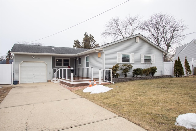 single story home with a garage, fence, concrete driveway, and a front yard