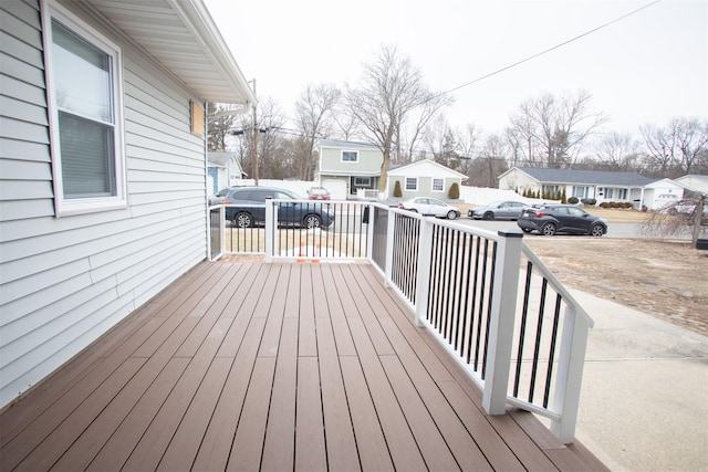 wooden terrace with a residential view