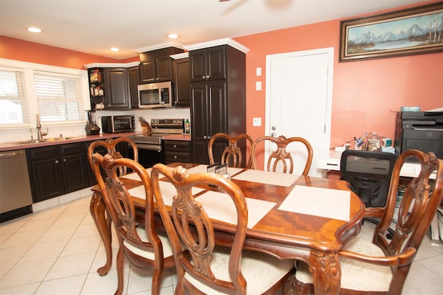 dining space featuring light tile patterned floors, a toaster, and recessed lighting