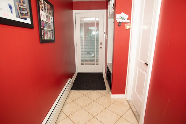 doorway to outside with light tile patterned floors and baseboards