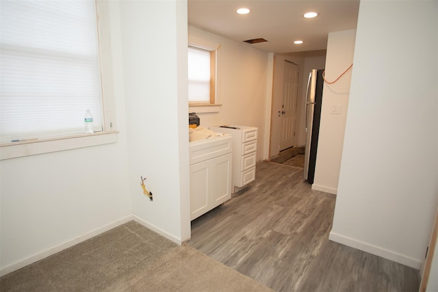 interior space with dark wood-style floors, recessed lighting, visible vents, and baseboards