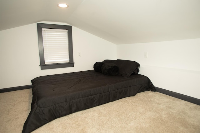 bedroom featuring recessed lighting, light carpet, vaulted ceiling, and baseboards