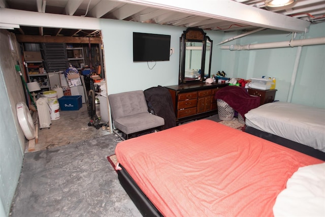 bedroom featuring concrete flooring