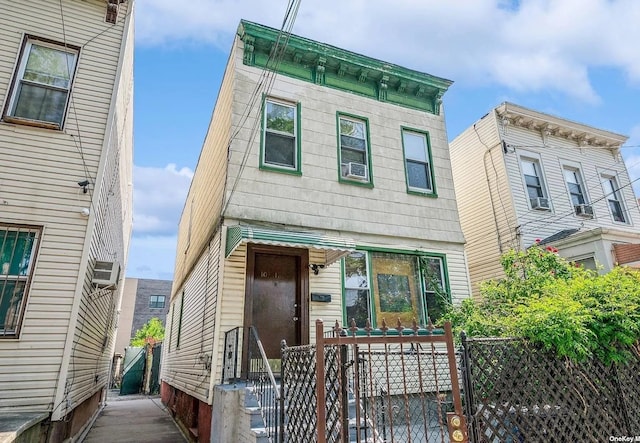 italianate house with a fenced front yard