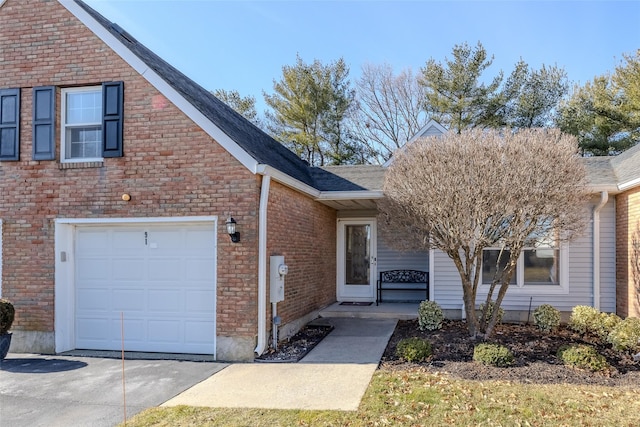 view of front of property featuring concrete driveway and brick siding