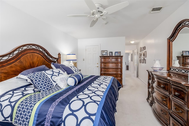 bedroom featuring light carpet, ceiling fan, and visible vents