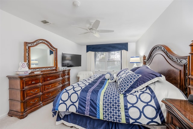 bedroom featuring carpet floors, visible vents, and a ceiling fan