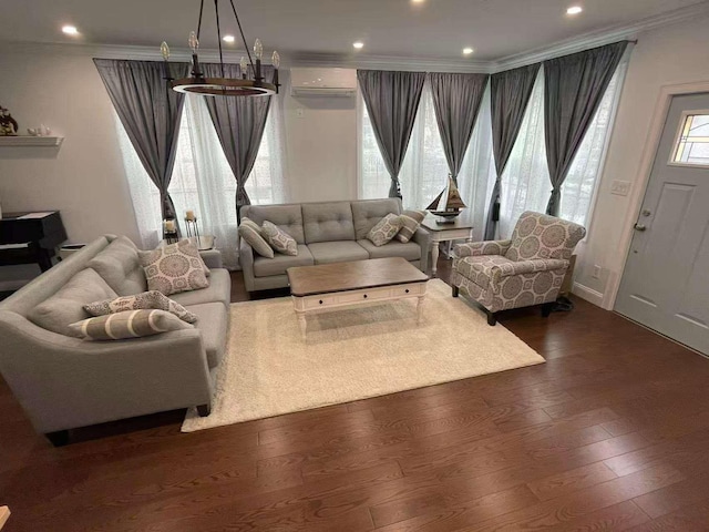 living area featuring baseboards, dark wood finished floors, crown molding, an AC wall unit, and recessed lighting