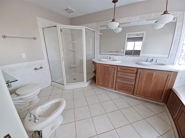 bathroom featuring tile walls, a bidet, a sink, and a shower stall