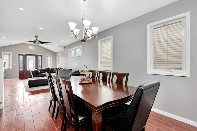 dining room featuring recessed lighting, wood tiled floor, vaulted ceiling, baseboards, and ceiling fan with notable chandelier