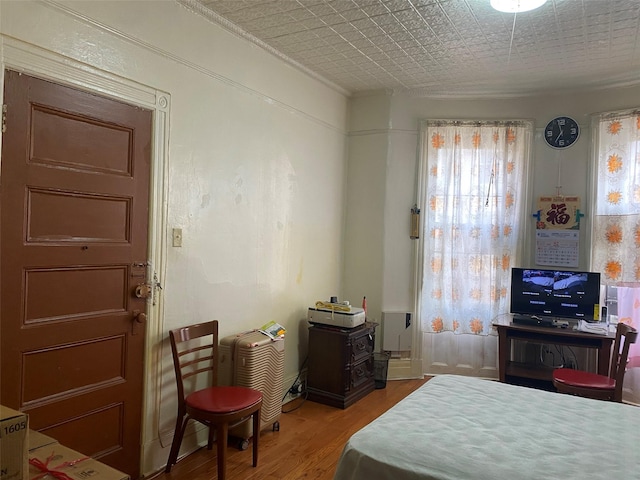 bedroom featuring wood finished floors