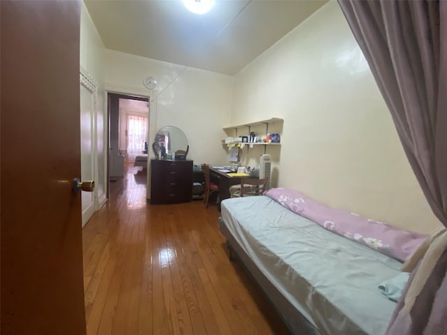 bedroom featuring wood finished floors