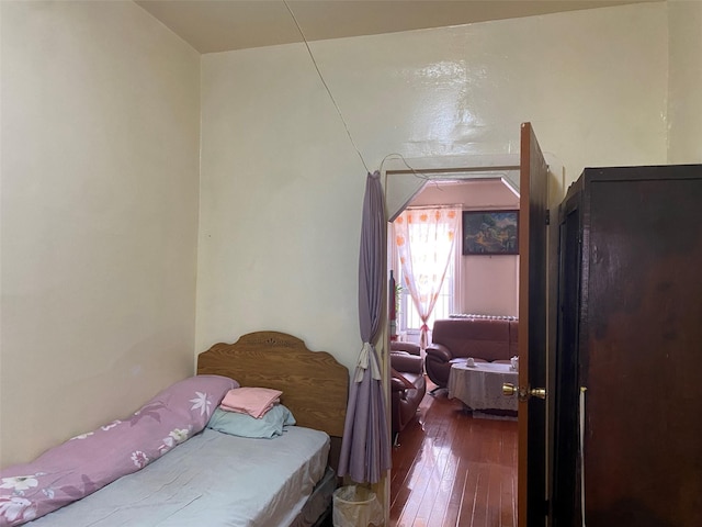 bedroom with wood finished floors