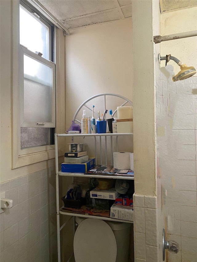 bathroom with tile walls