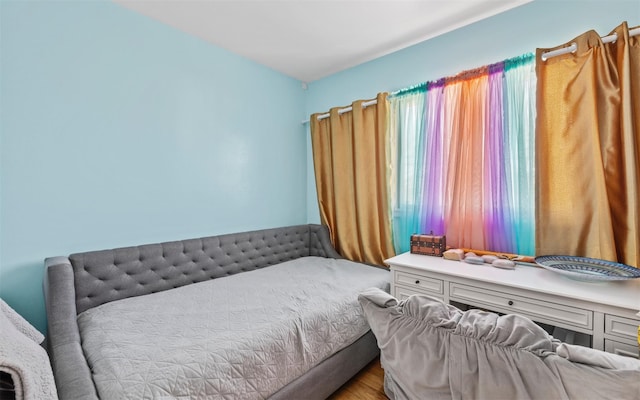 bedroom featuring wood finished floors