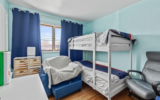 bedroom with wood finished floors