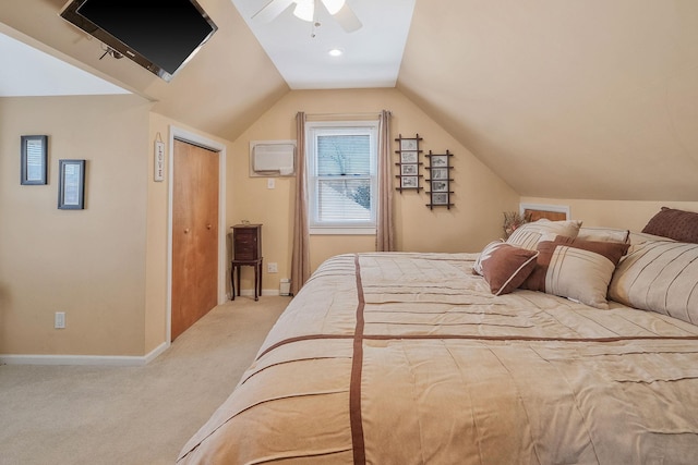 bedroom with light carpet, baseboards, lofted ceiling, ceiling fan, and a closet